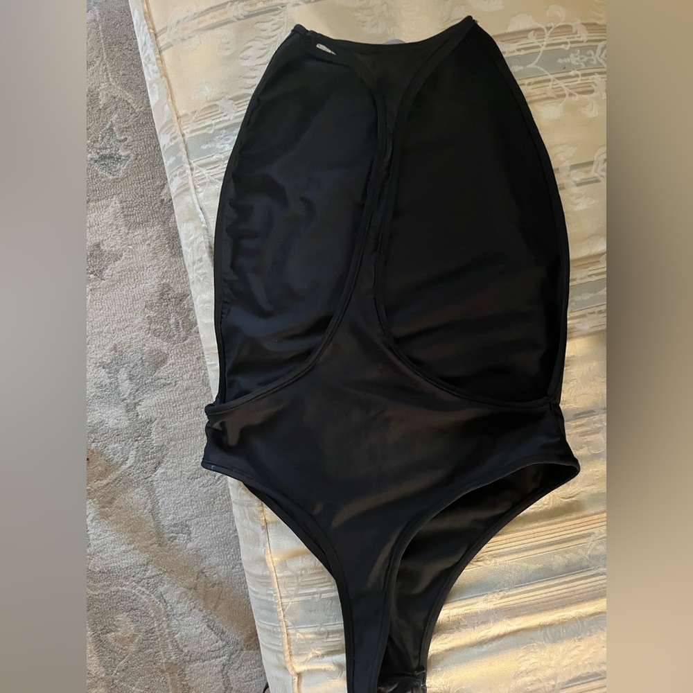 Sexy open back/side bodysuit. NEVER WORN. Purchased from Revolve